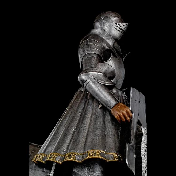 glittering armour with pleated skirt and decorated with silver